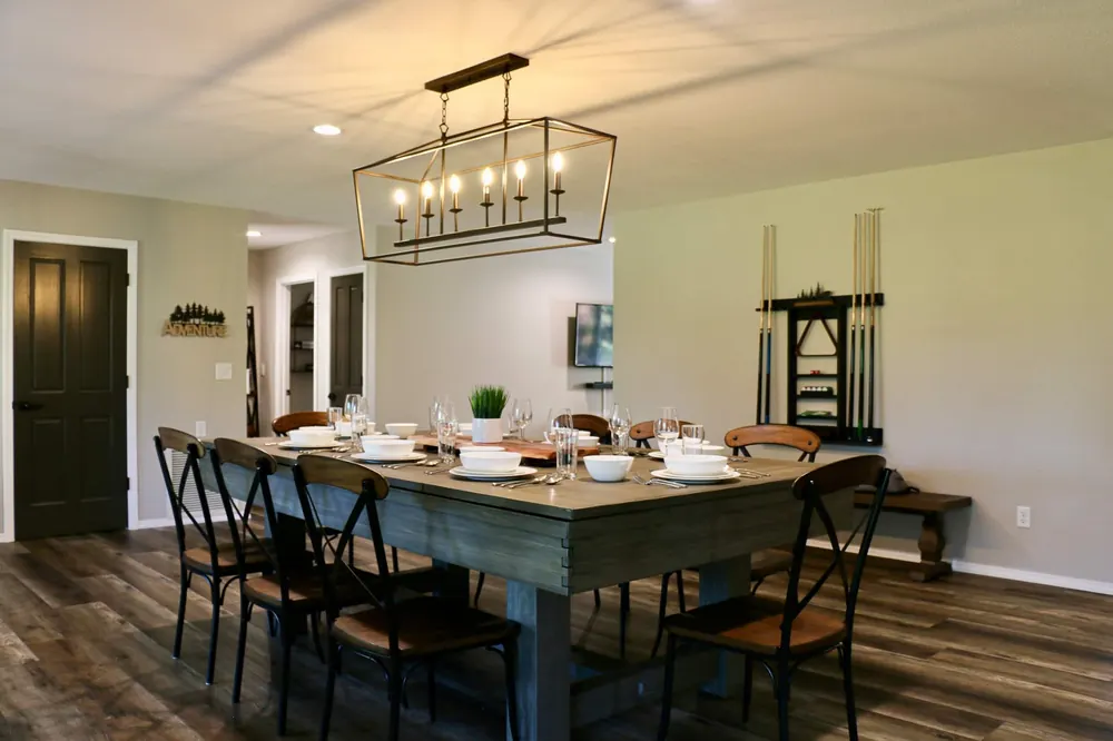 Dining table set for twelve under a lantern chandelier