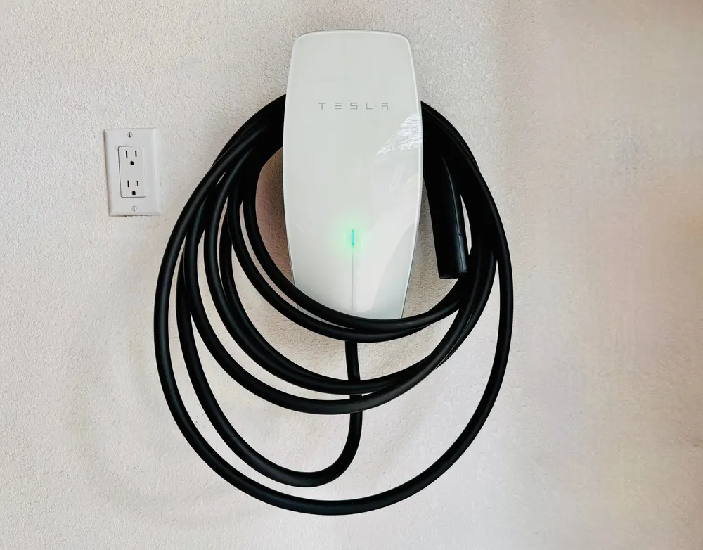 Electric vehicle wall charger in the garage