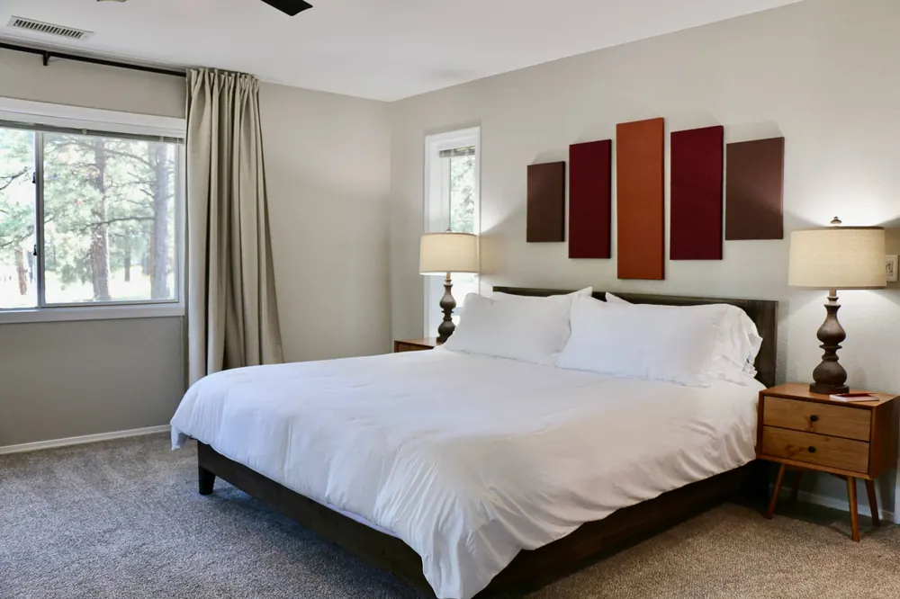 King bed in the Grand Canyon Suite with canyon-colored wall panels